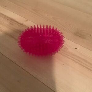 Pink rubber squeaky ball dog toy